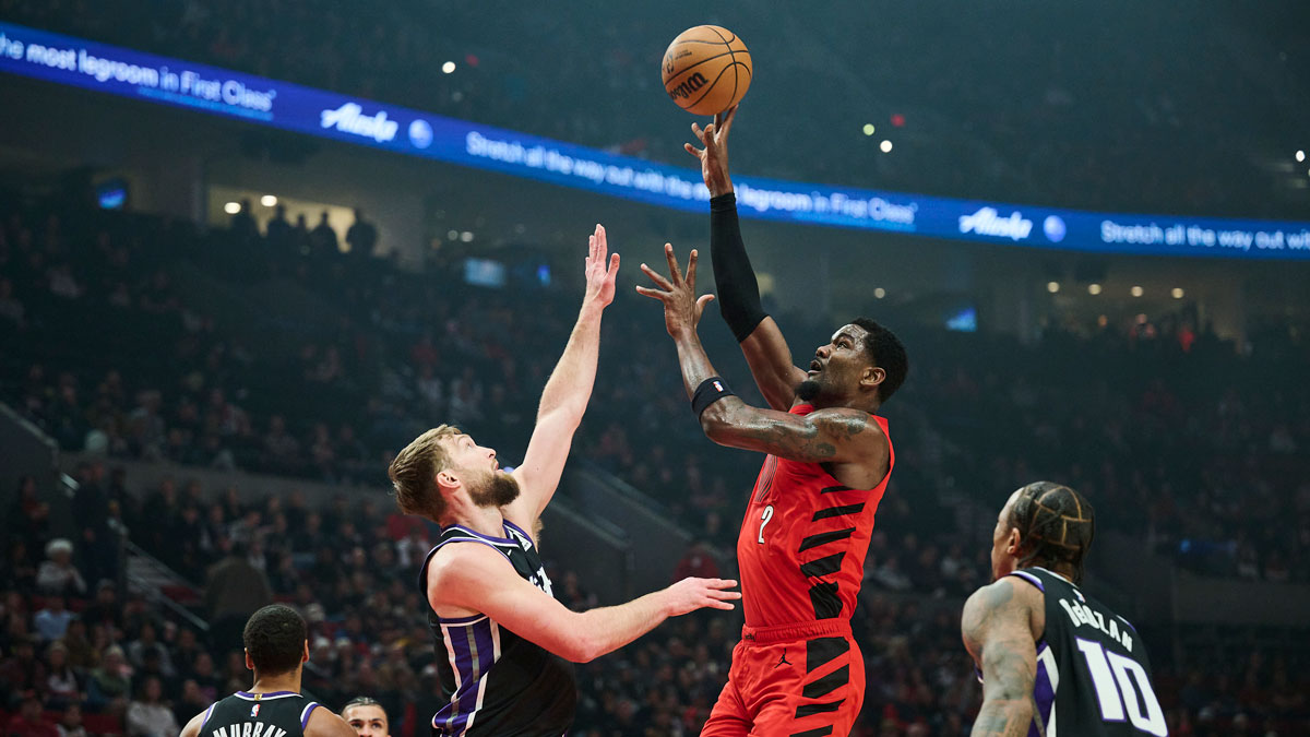Portland Trail Blazers center Deandre Ayton (2) shoots a jump shot the ball during the first half against Sacramento Kings forward Domantas Sabonis (11) at Moda Center.