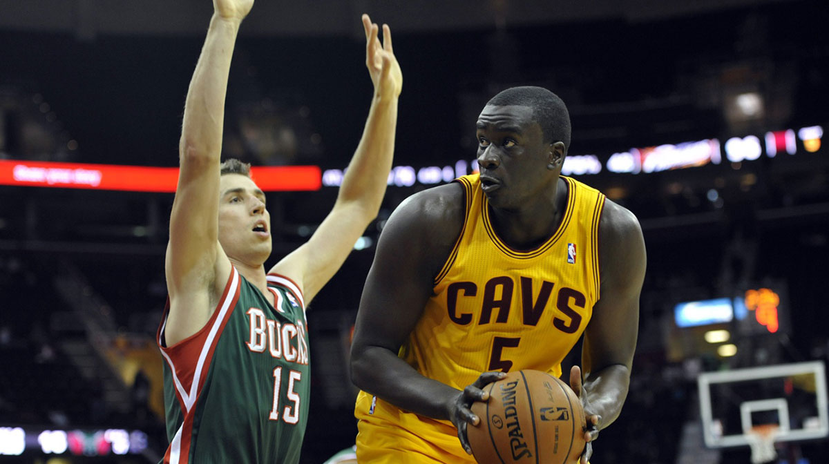 Milwaukee Bucks forward Olek Czyz (15) defends Cleveland Cavaliers center DeSagana Diop (5) in the fourth quarter at Quicken Loans Arena.