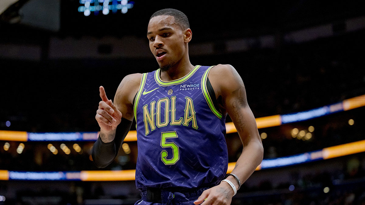New Orleans Pelicans guard Dejounte Murray (5) indicates an and one foul shot after making a basket against the Minnesota Timberwolves during the first half at Smoothie King Center.