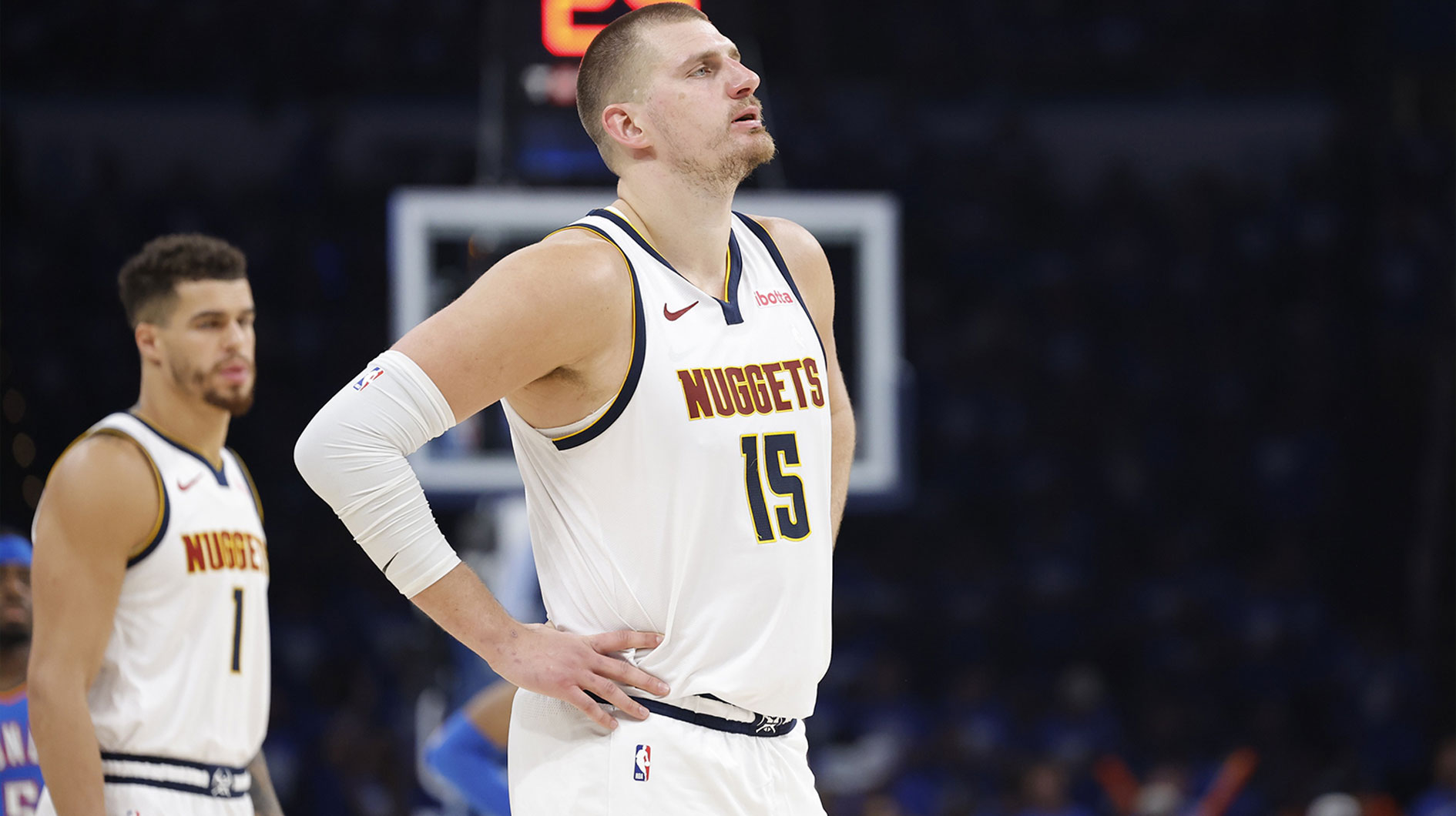 Denver Nuggets center Nikola Jokic (15) watches Oklahoma City Thunder guard Shai Gilgeous-Alexander shoot free throws in the second half of game seven of the second round for the 2025 NBA Playoffs at Paycom Center.