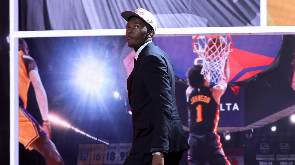 Derik Queen reacts on stage after being selected as the 13th pick by the Atlanta Hawks in the first round of the 2025 NBA Draft.