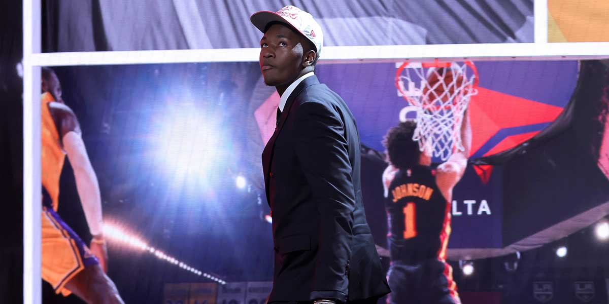Derik Queen reacts on stage after being selected as the 13th pick by the Atlanta Hawks in the first round of the 2025 NBA Draft at Barclays Center.