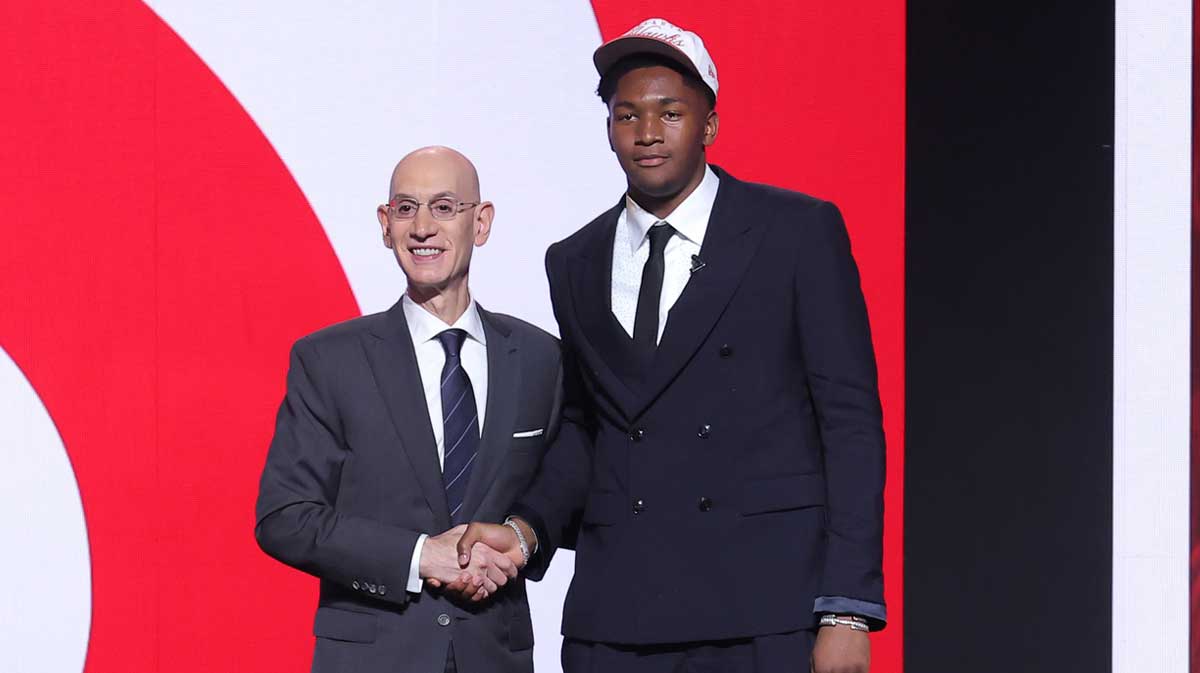 Derik Queen stands with NBA commissioner Adam Silver after being selected as the 13th pick by the Atlanta Hawks in the first round of the 2025 NBA Draft at Barclays Center.