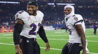 Baltimore Ravens running back Derrick Henry (22) and quarterback Lamar Jackson (8) smile after the game against the Houston Texans at NRG Stadium.