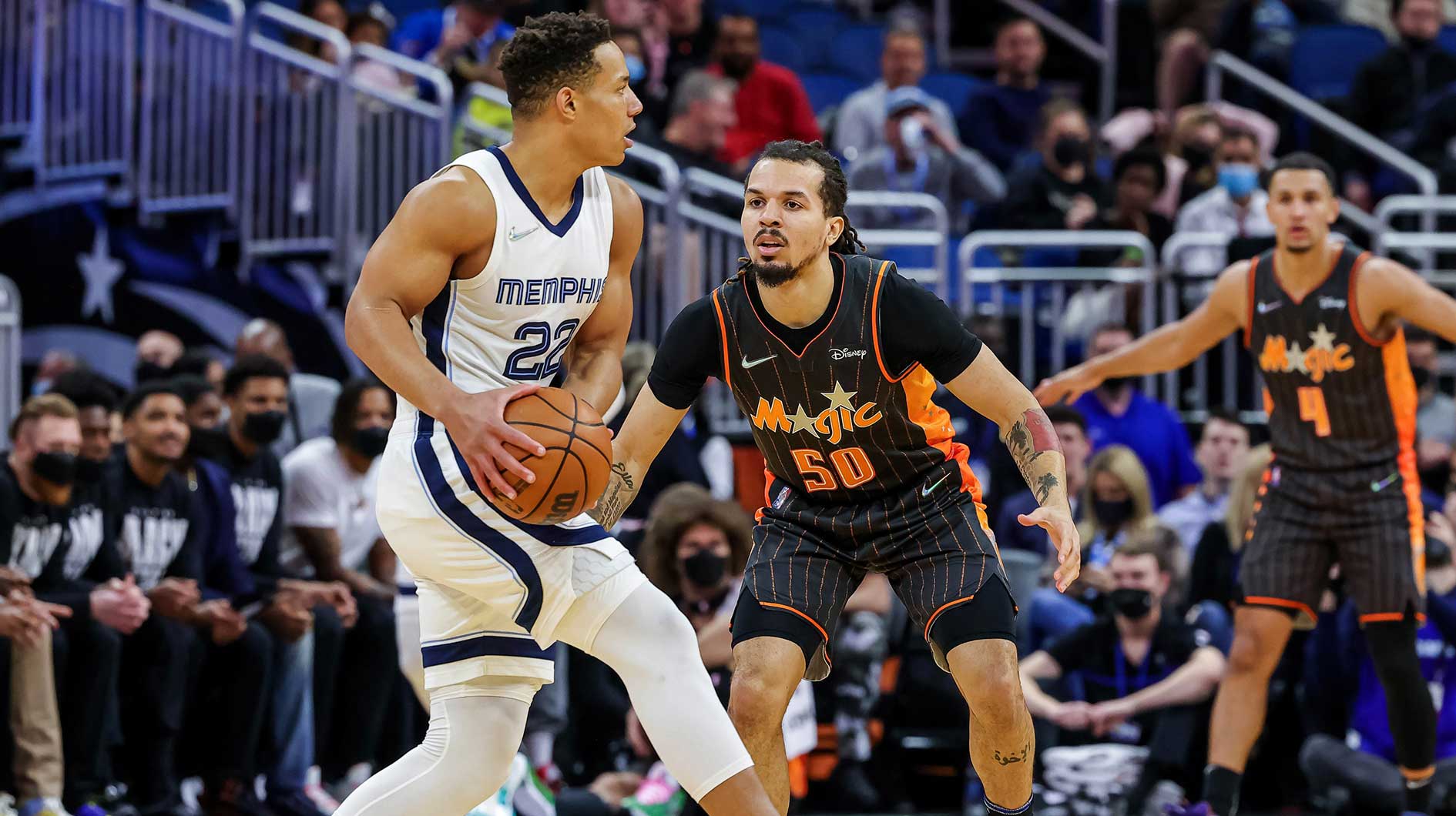 Memphis Grizzlies guard Desmond Bane (22) looks to pass against Orlando Magic guard Cole Anthony (50) during the first quarter at Amway Center.