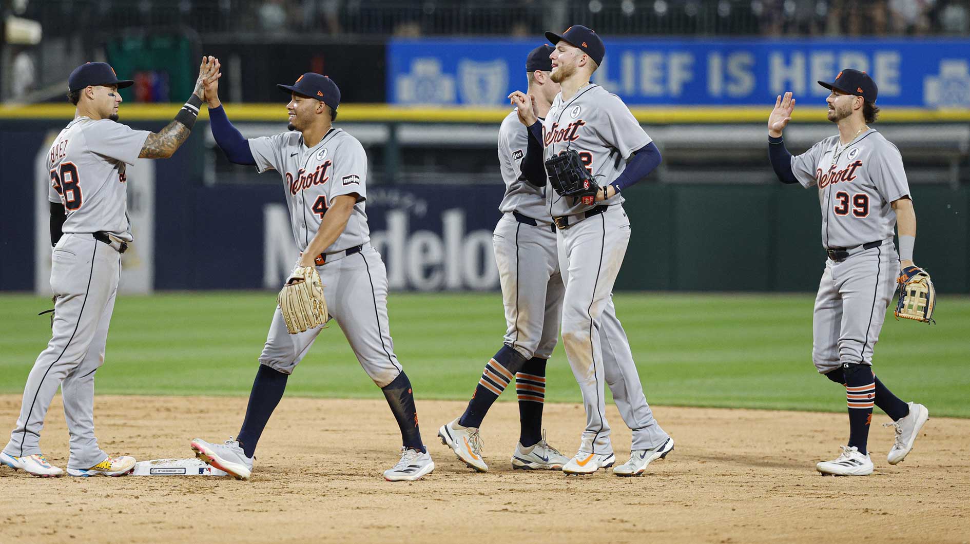 Detroit Tigers players celebrate after defeating the Chicago White Sox in a baseball game at Rate Field.