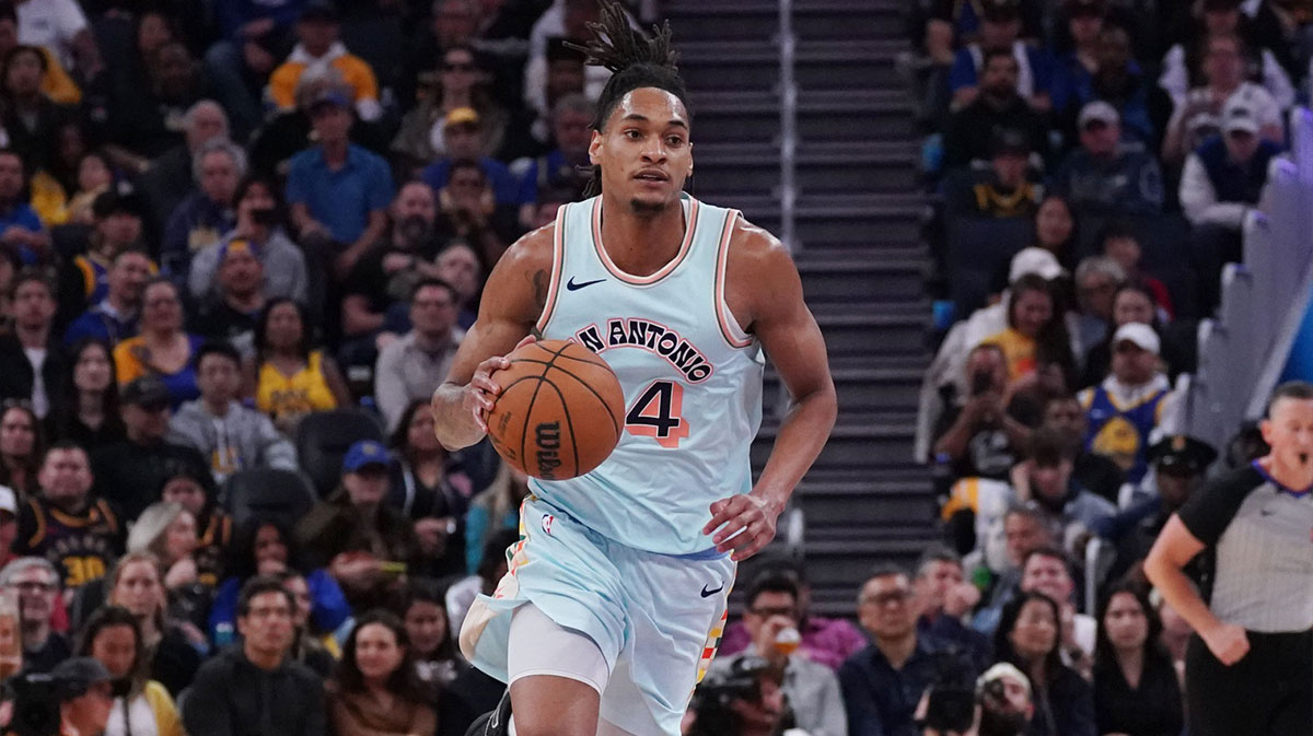 San Antonio Spurs guard-forward Devin Vassell (24) dribbles the ball upcourt in the third quarter against the Golden State Warriors at Chase Center.