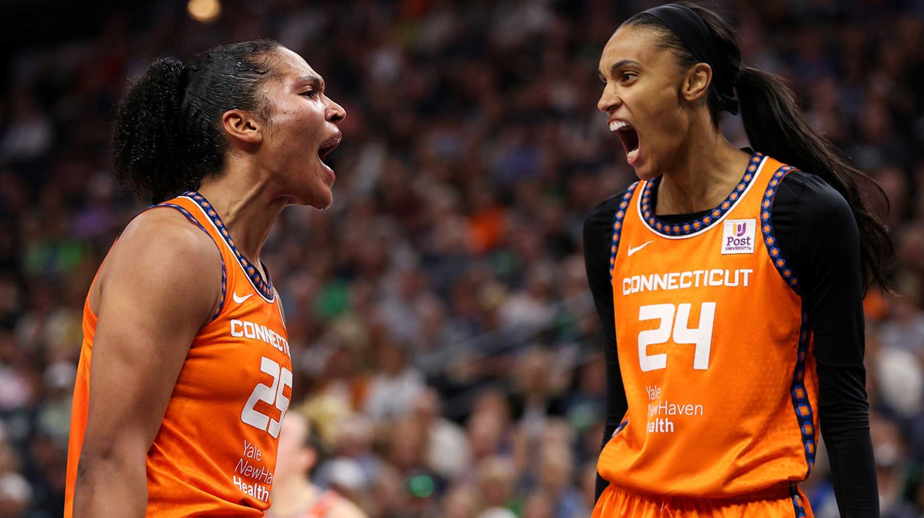 Connecticut Sun forward Alyssa Thomas (25) celebrates her shot with forward DeWanna Bonner (24) during the first half against the Minnesota Lynx of game one of the 2024 WNBA Semi-finals at Target Center.