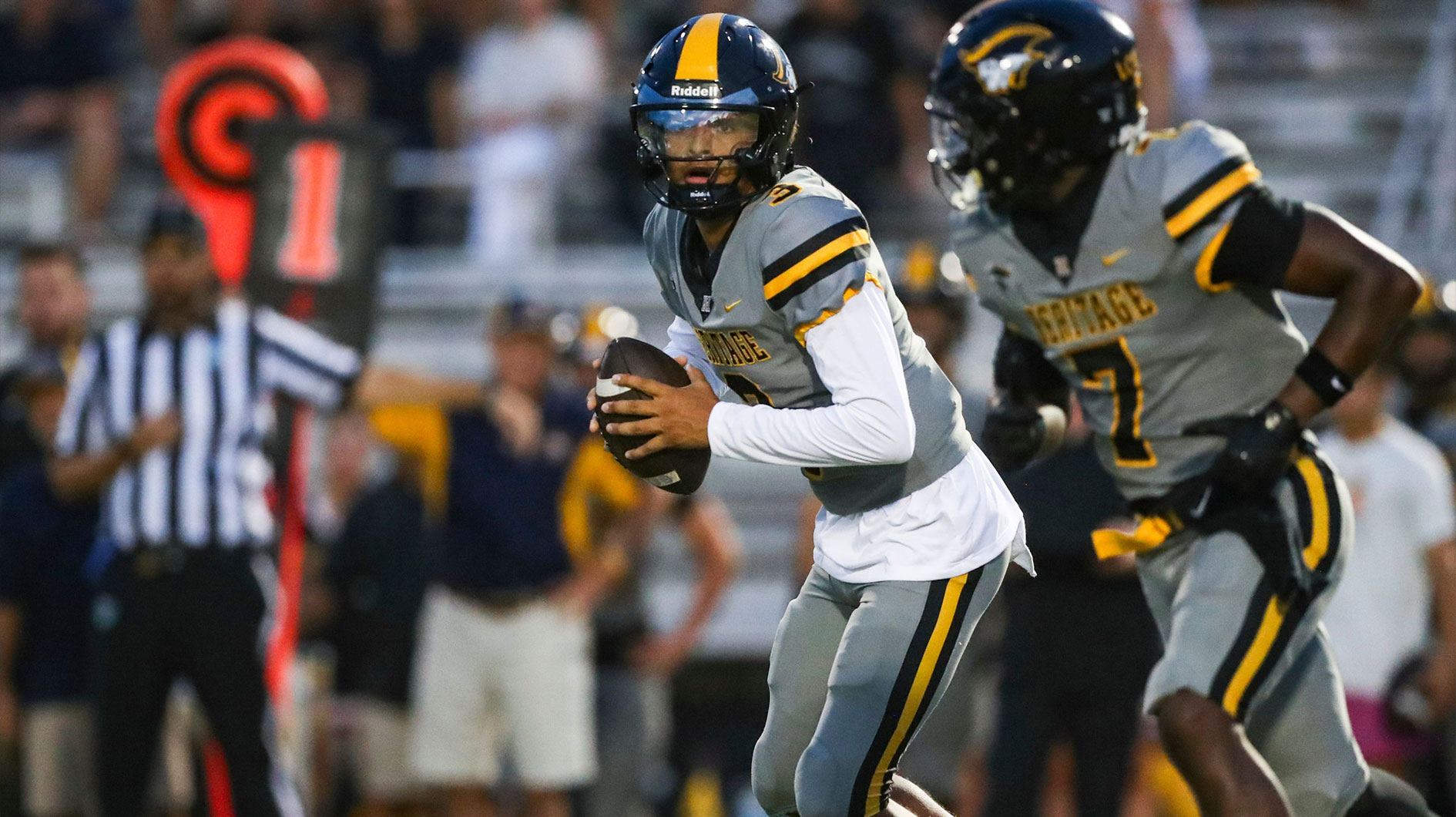 American Heritage Patriots quarterback Dia Bell (3) runs an option play during the first quarter of a game against the Naples Golden Eagles at Staver Field in Naples on Friday, Sept. 13, 2024.