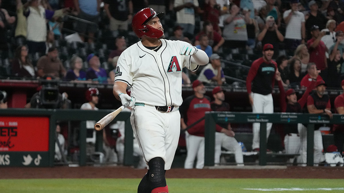 Arizona Diamondbacks first base Josh Naylor (22) hits a walk off grand slam home run against the Seattle Mariners in the eleventh inning at Chase Field.