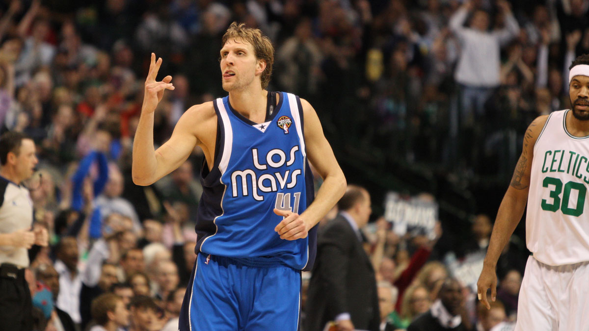 Dallas Mavericks forward Dirk Nowitzki (41) celebrates a three point basket against the Boston Celtics at American Airlines Arena. The Celtics beat the Mavs 102-93.