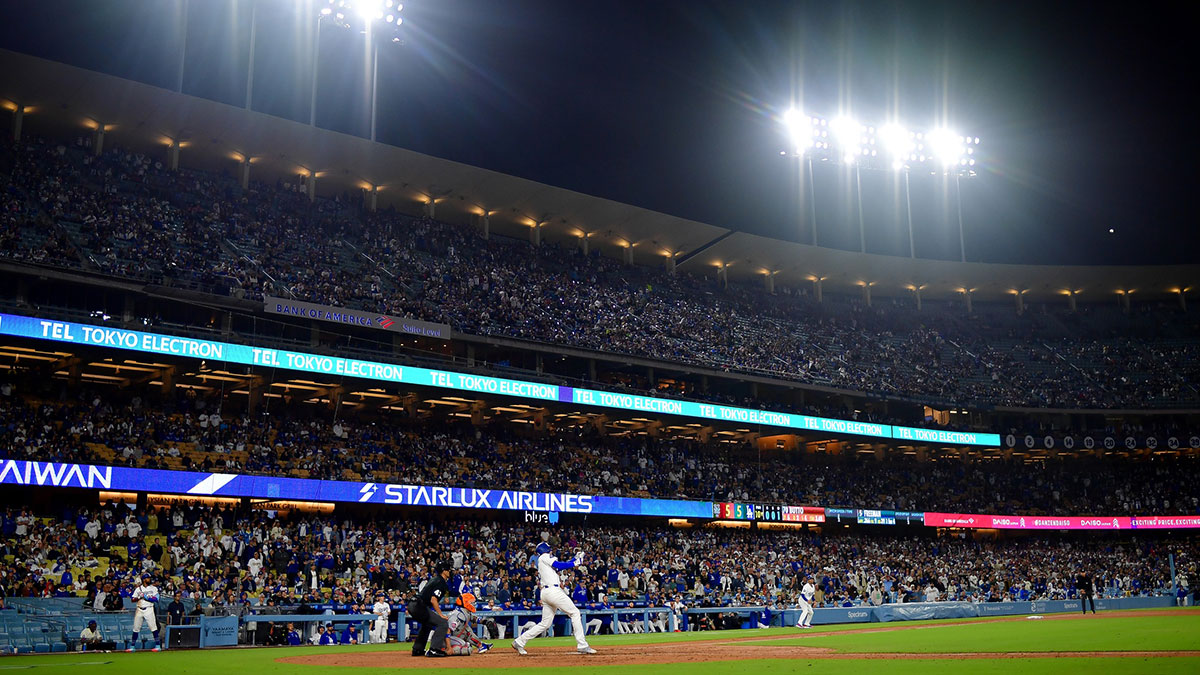 Los Angeles Dodgers first baseman Freddie Freeman (5) hits a walk off RBI double against the New York Mets during the tenth inning at Dodger Stadium.