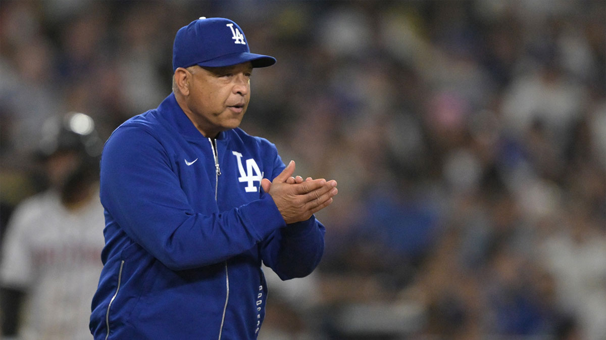 os Angeles Dodgers manager Dave Roberts (30) walks to the mound for a pitching change in the eighth inning against the Arizona Diamondbacks at Dodger Stadium.