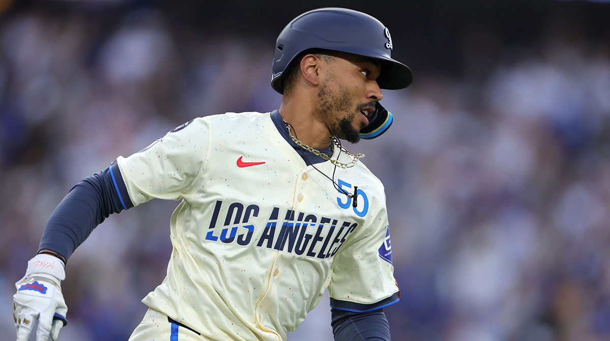 Los Angeles Dodgers shortstop Mookie Betts (50) rounds first base after hitting a double in the second inning against the San Francisco Giants at Dodger Stadium.