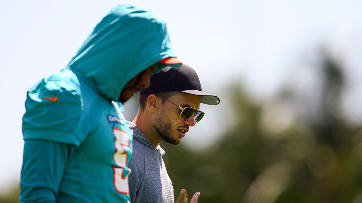 Miami Dolphins head coach Mike McDaniel talks to cornerback Jalen Ramsey (5) during mandatory minicamp at Baptist Health Training Complex.