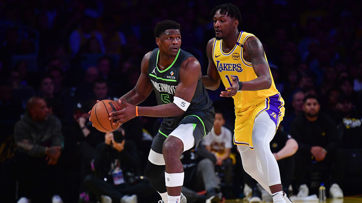 Minnesota Timberwolves guard Anthony Edwards (5) moves the ball against Los Angeles Lakers forward Dorian Finney-Smith (17) during the first half in game five of first round for the 2025 NBA Playoffs at Crypto.com Arena.