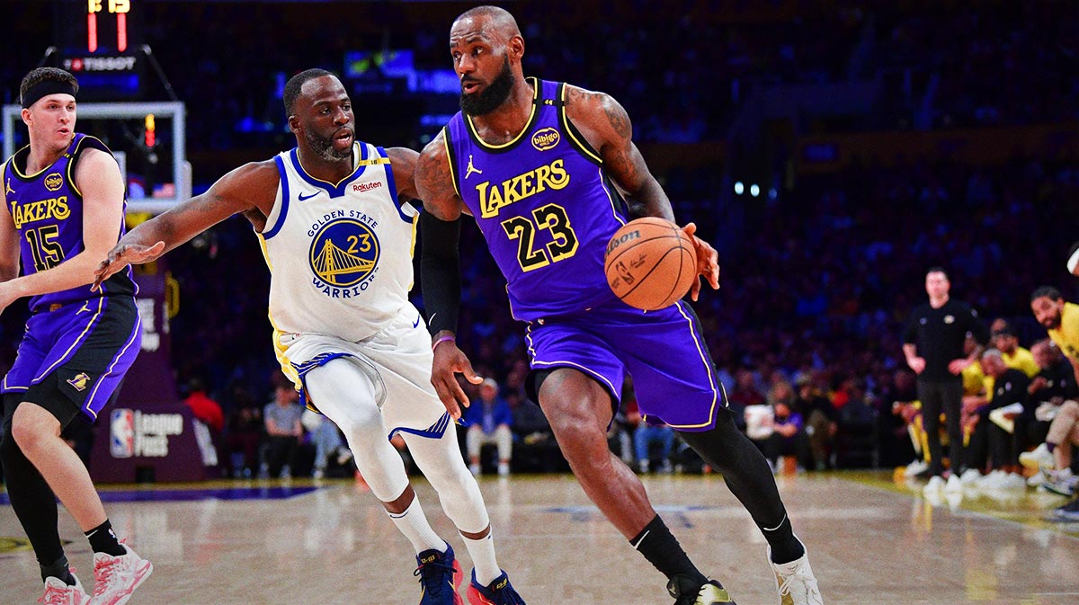 Los Angeles Lakers forward LeBron James (23) moves the ball against Golden State Warriors forward Draymond Green (23) during the first half at Crypto.com Arena.