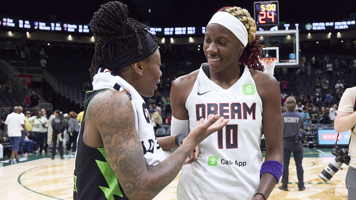 Seattle Storm guard Erica Wheeler talks with Atlanta Dream guard Rhyne Howard after the game at Climate Pledge Arena.