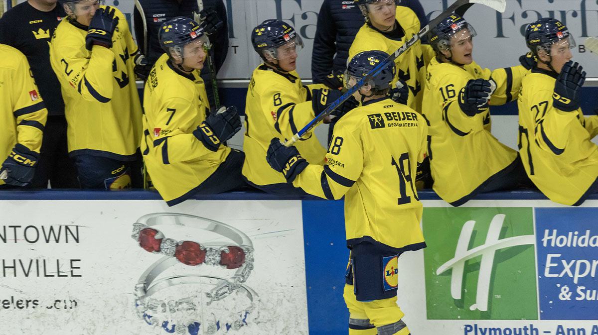 Sweden's forward Victor Eklund (18) celebrates a goal against Finland with teammates during the first period of the 2024 World Junior Summer Showcase at USA Hockey Arena.