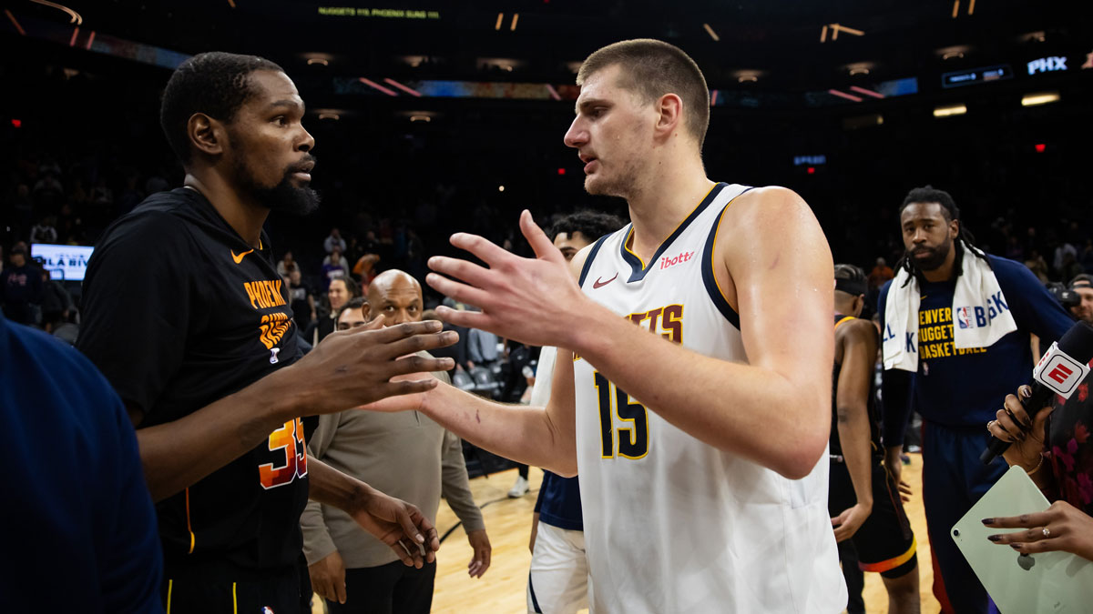 Denver Nuggets center Nikola Jokic (right) greets Phoenix Suns forward Kevin Durant following the game at Footprint Center.