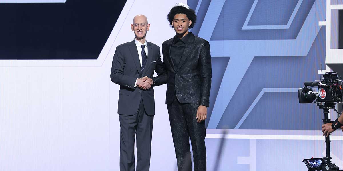 Dylan Harper stands with NBA commissioner Adam Silver after being selected as the second pick by the San Antonio Spurs in the first round of the 2025 NBA Draft at Barclays Center.