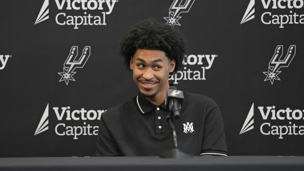 Jun 28, 2025; San Antonio, TX, USA; San Antonio first round draft pick Dylan Harper (2) reacts to a question from the media during a press conference at Victory Capital Performance Center.