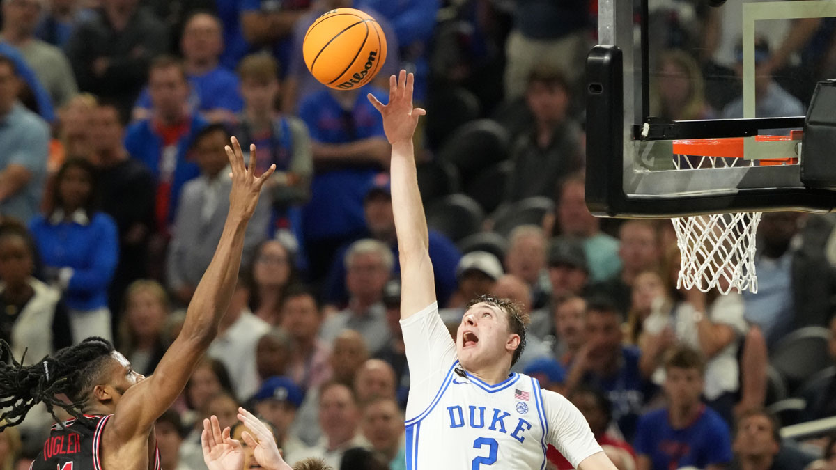 Duke Blue Devils forward Cooper Flagg (2) and Houston Cougars forward Joseph Tugler (11) battle for the ball in the semifinals of the men's Final Four of the 2025 NCAA Tournament at the Alamodome.
