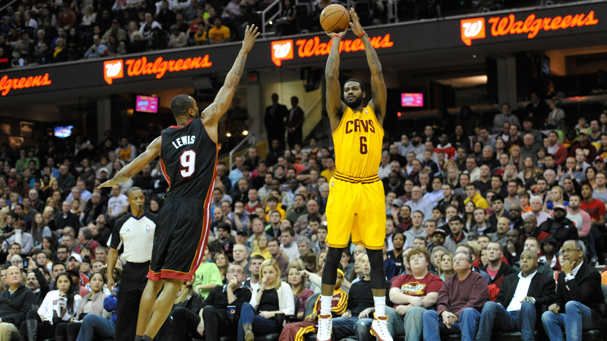 Cleveland Cavaliers small forward Earl Clark (6) shoots over Miami Heat power forward Rashard Lewis (9) during a game at Quicken Loans Arena. Miami won 95-84.