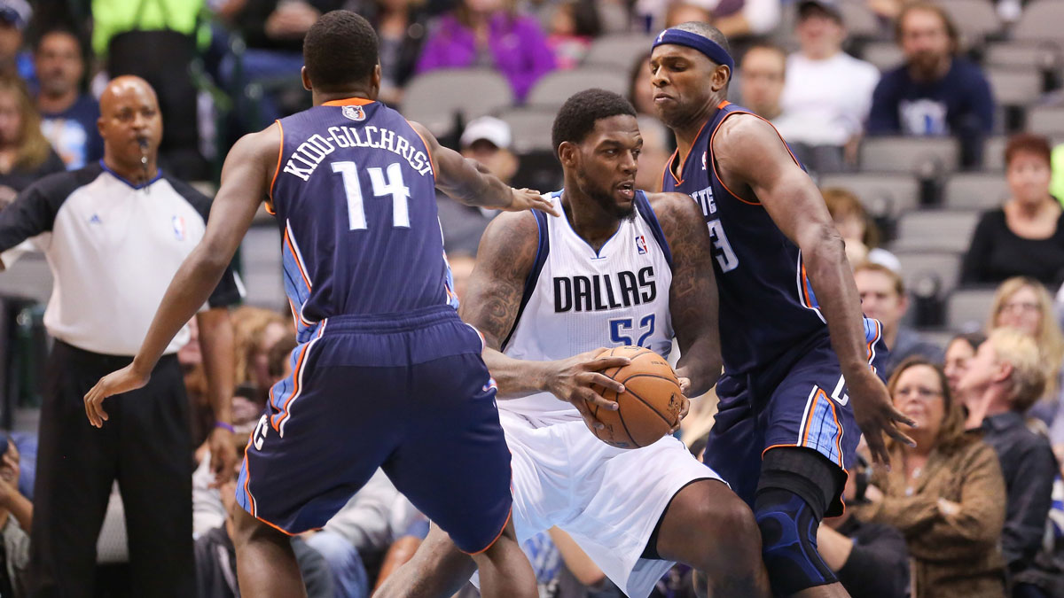 Dallas Mavericks center Eddy Curry (52) makes a move on Charlotte Bobcats center Brendan Haywood (33) during the first quarter at the American Airlines Center.