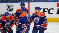 Edmonton Oilers center Connor McDavid (97) celebrates scoring with defenseman Mattias Ekholm (14) and center Leon Draisaitl (29) and defenseman Evan Bouchard (2) during the third period against the Florida Panthers in game five of the 2025 Stanley Cup Final at Rogers Place.