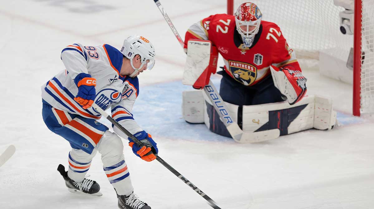 Edmonton Oilers center Ryan Nugent-Hopkins (93) controls the puck as Florida Panthers goaltender Sergei Bobrovsky (72) defends the net during the second period in game six of the 2025 Stanley Cup Final at Amerant Bank Arena