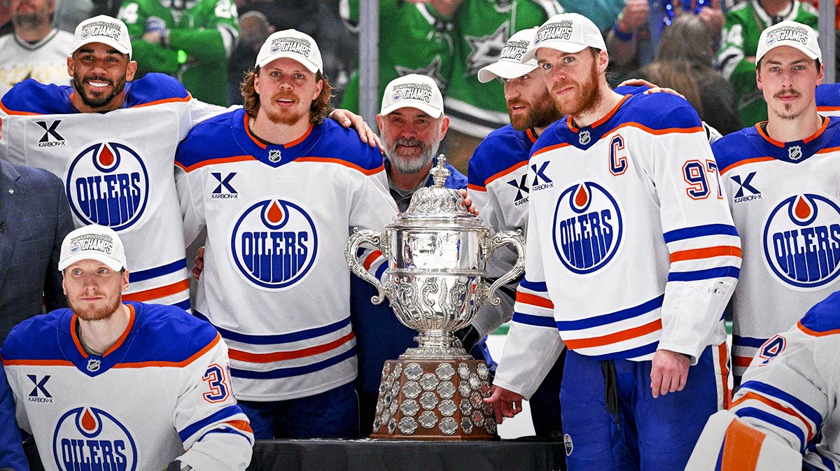 The Edmonton Oilers pose with the Clarence S. Campbell Bowl after the game between the Dallas Stars and the Edmonton Oilers in game five of the Western Conference Final of the 2025 Stanley Cup Playoffs at American Airlines Center.