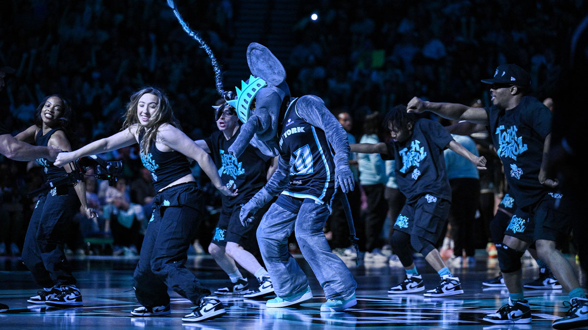 New York Liberty mascot Ellie the Elephant and the Torch Patrol perform during the second half of a game between the New York Liberty and the Connecticut Sun at Barclays Center.