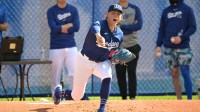 Los Angeles Dodgers starting pitcher Emmet Sheehan (80) throws in the bullpen during workouts at spring training at Camelback Ranch.