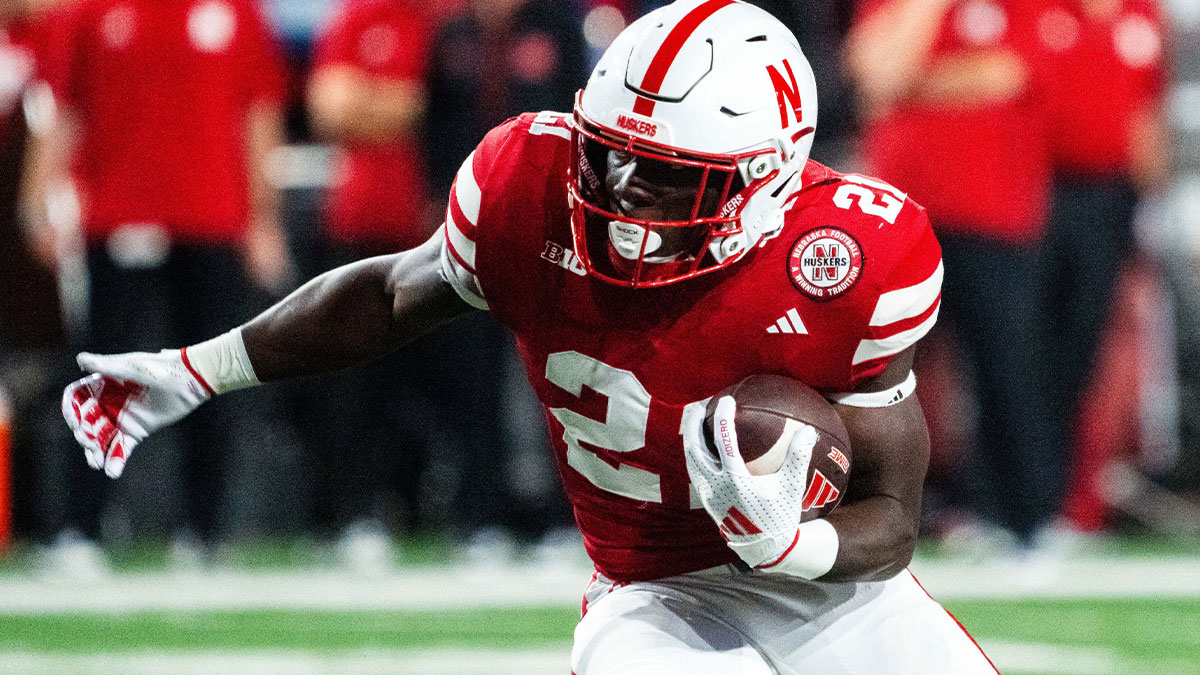 Nebraska Cornhuskers running back Emmett Johnson (21) runs against the Colorado Buffaloes during the fourth quarter at Memorial Stadium.