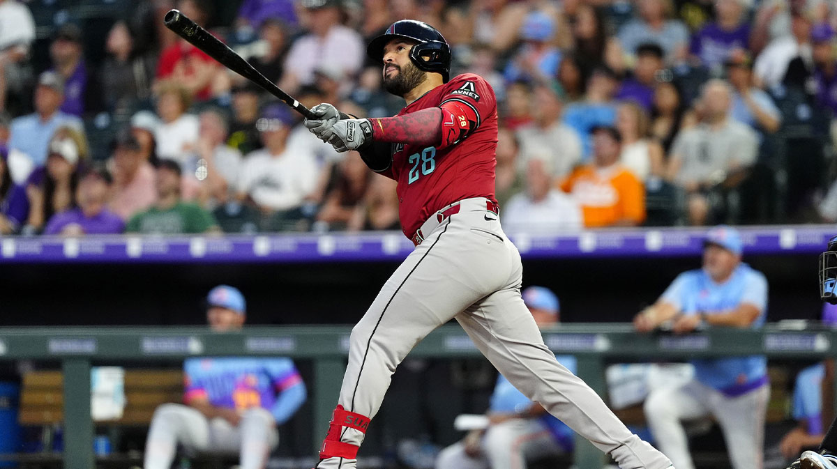 Jun 20, 2025; Denver, Colorado, USA; Arizona Diamondbacks third baseman Eugenio Suarez (28) hits a two run home run in the sixth inning against the Colorado Rockies at Coors Field.