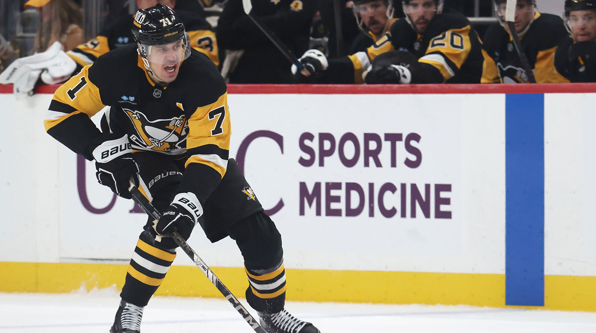 Pittsburgh Penguins center Evgeni Malkin (71) skates with the puck against the Boston Bruins during the third period at PPG Paints Arena.