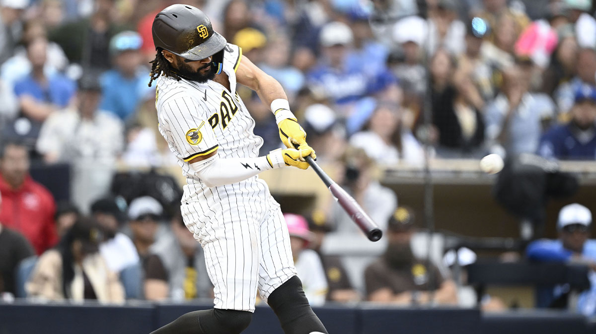 Jun 21, 2025; San Diego, California, USA; San Diego Padres right fielder Fernando Tatis Jr. (23) hits a three-run home run during the seventh inning against the Kansas City Royals at Petco Park.