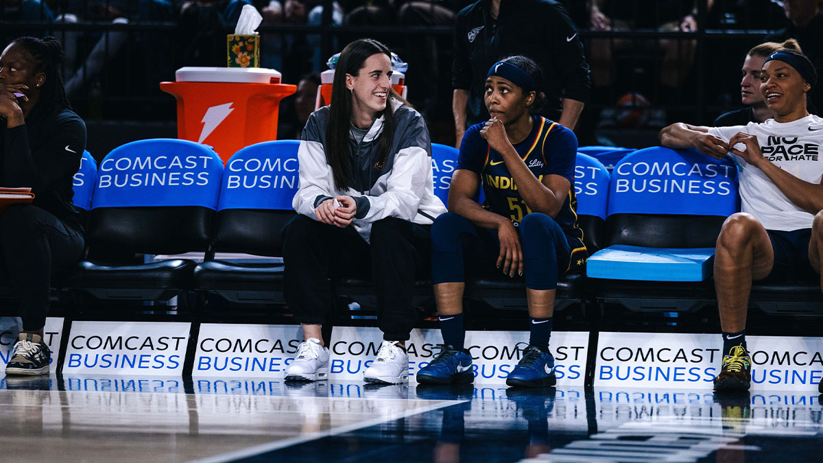 Indiana Fever guard Caitlin Clark talks with guard Sydney Colson in the second half against the Washington Mystics at Entertainment & Sports Arena.