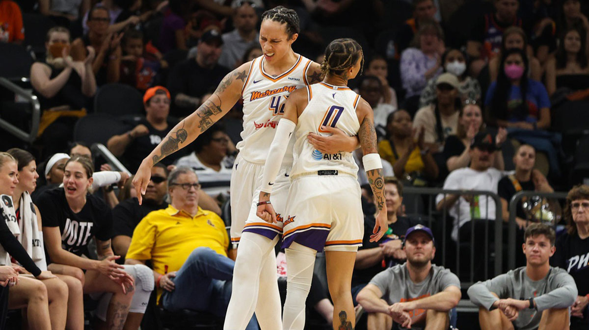 Phoenix Mercury center Brittney Griner (42) celebrates with Phoenix Mercury guard Natasha Cloud (0) after an and-one