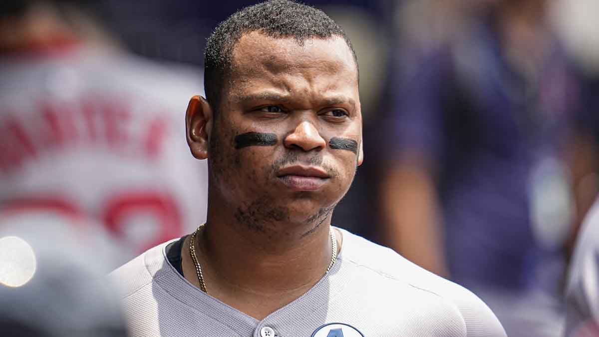 Boston Red Sox designated hitter Rafael Devers (11) shown in the dugout before the game against the Atlanta Braves at Truist Park.