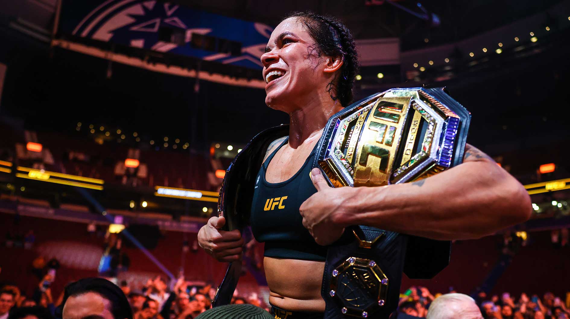 Amanda Nunes celebrates her victory by decision against Irene Aldana following UFC 289 at Rogers Arena.
