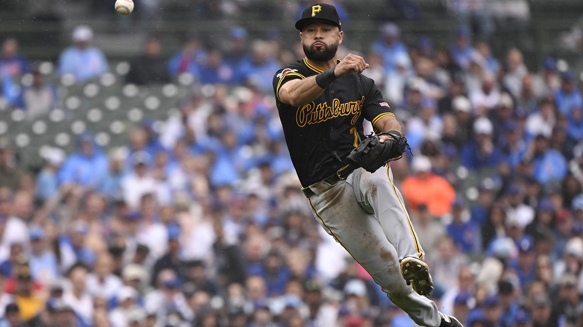 Pittsburgh Pirates shortstop Isiah Kiner-Falefa (7) throws Chicago Cubs third baseman Matt Shaw (6) out at first base during the ninth inning at Wrigley Field.