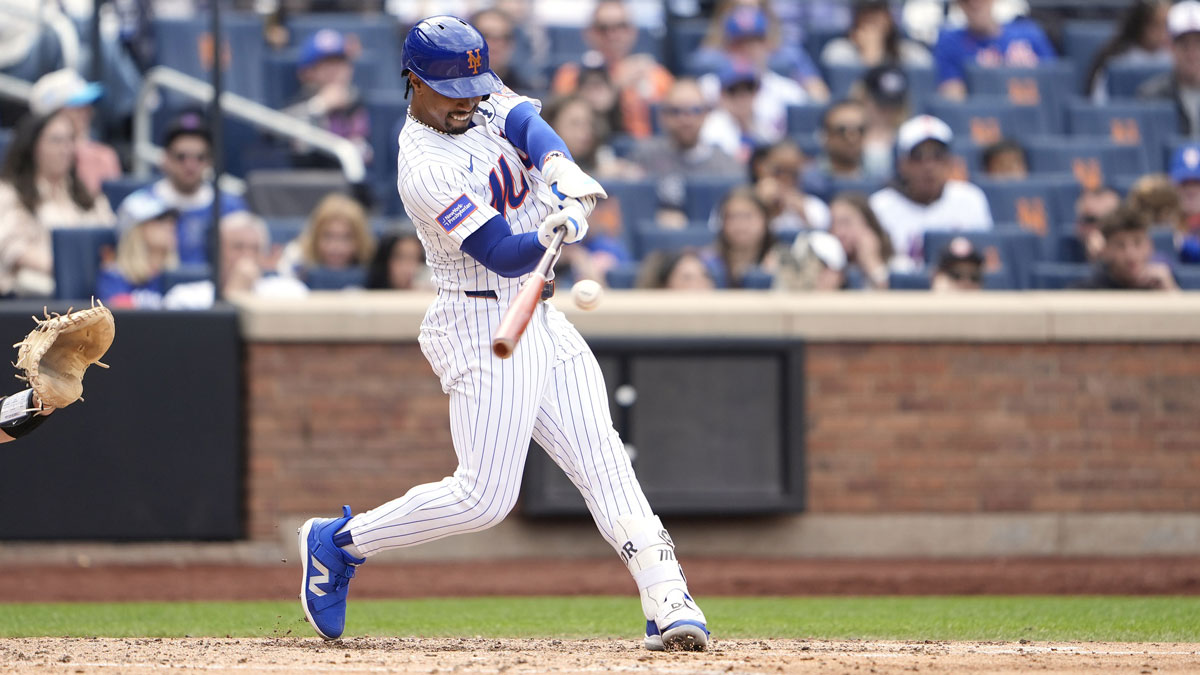 Jun 1, 2025; New York City, New York, USA; New York Mets shortstop Francisco Lindor (12) hits a home run against the Colorado Rockies during the fifth inning at Citi Field.