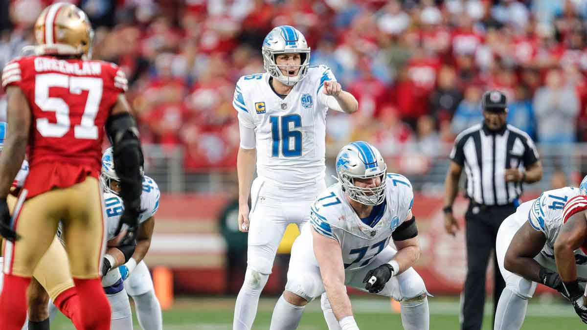 Lions quarterback Jared Goff talks to center Frank Ragnow before a snap against 49ers during the first half of the NFC championship game at Levi's Stadium in Santa Clara, California, on Sunday, Jan. 28, 2024.