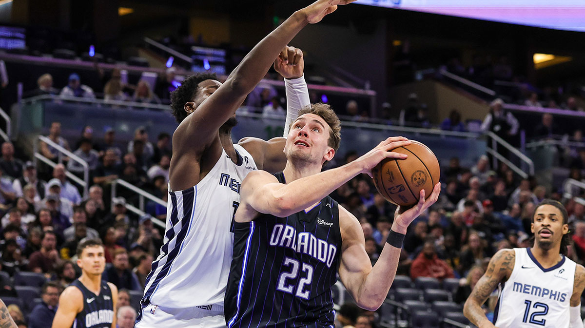 Orlando Magic forward Franz Wagner (22) is fouled by Memphis Grizzlies forward Jaren Jackson Jr. (13) during the second quarter at Kia Center.