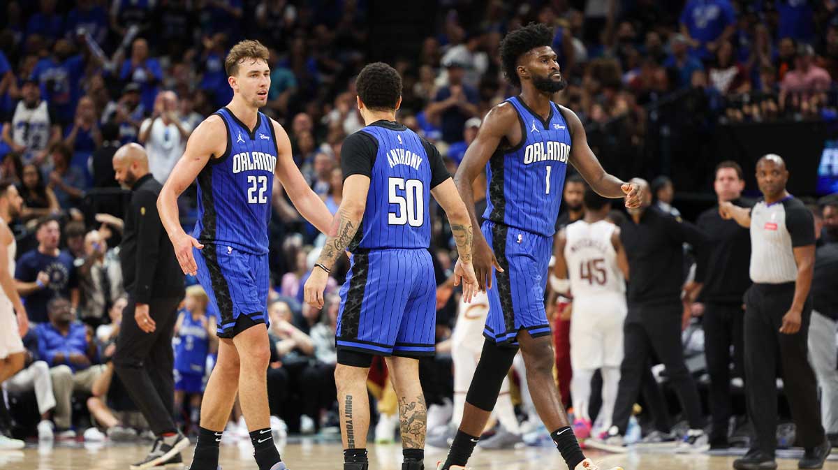 Orlando Magic forward Franz Wagner (22) guard Cole Anthony (50) and forward Jonathan Isaac (1) celebrate after a basket against the Cleveland Cavaliers in the fourth quarter during game four of the first round for the 2024 NBA playoffs at Kia Center.
