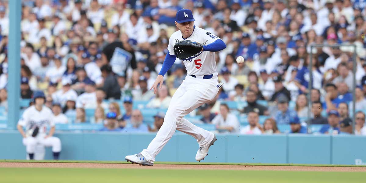 May 30, 2025; Los Angeles, California, USA; Los Angeles Dodgers first baseman Freddie Freeman (5) fields a ground ball during the first inning against the New York Yankees at Dodger Stadium.