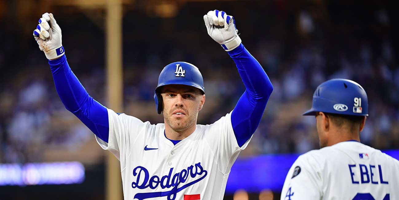 Jun 3, 2025; Los Angeles, California, USA; Los Angeles Dodgers first base Freddie Freeman (5) reacts after hitting a RBI single against the New York Mets during the first inning at Dodger Stadium. Mandatory Credit: Gary A. Vasquez-Imagn Images