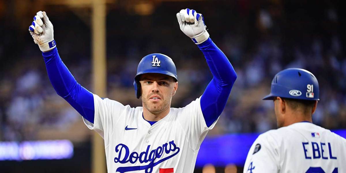 Jun 3, 2025; Los Angeles, California, USA; Los Angeles Dodgers first base Freddie Freeman (5) reacts after hitting a RBI single against the New York Mets during the first inning at Dodger Stadium. Mandatory Credit: Gary A. Vasquez-Imagn Images